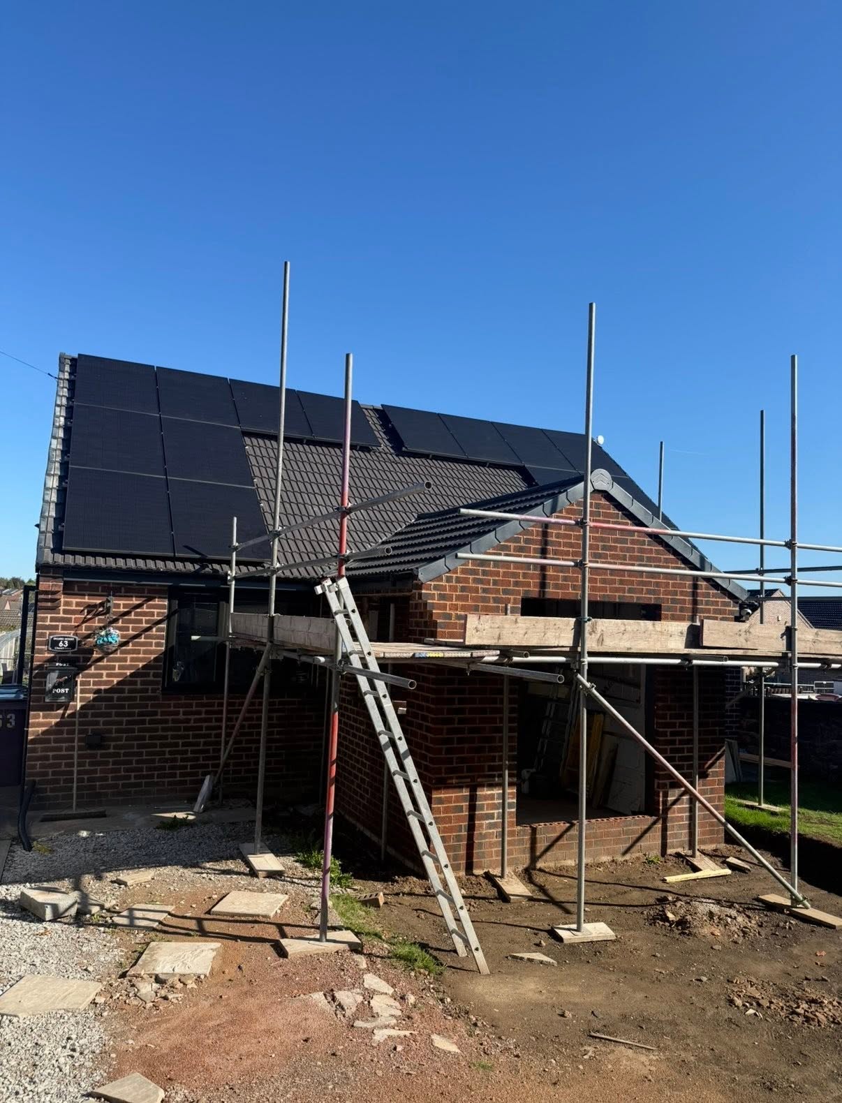 Completed dormer loft conversion with solar panel roof