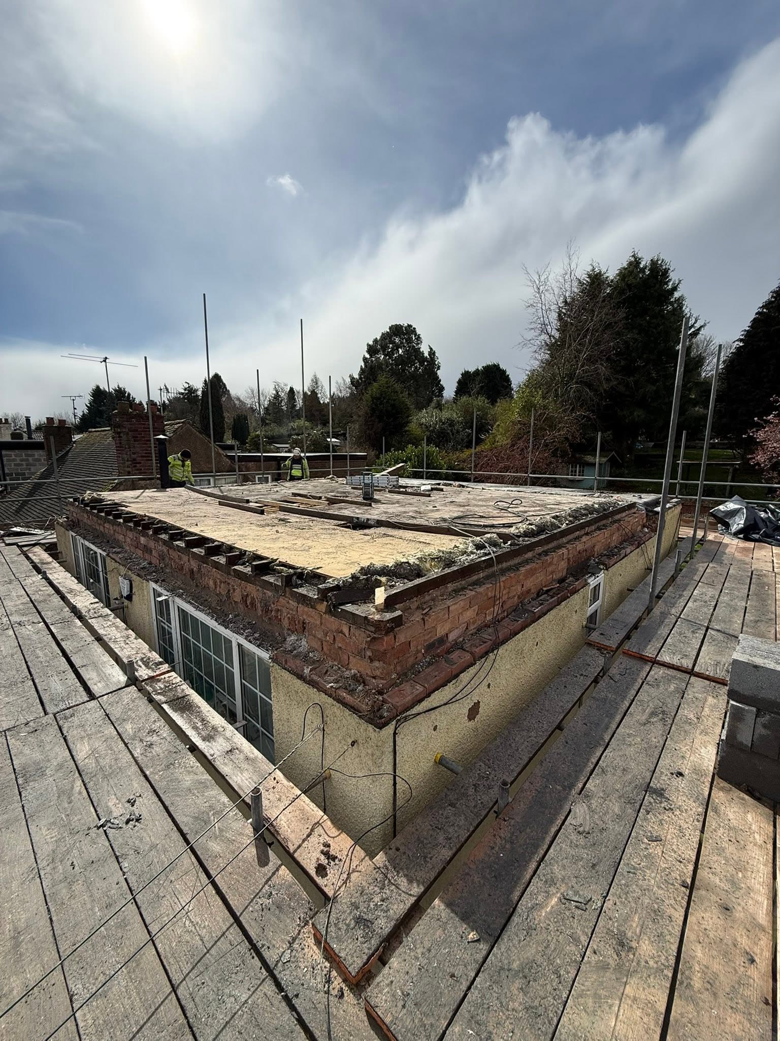 Roof strip out in progress showing old tiles removed